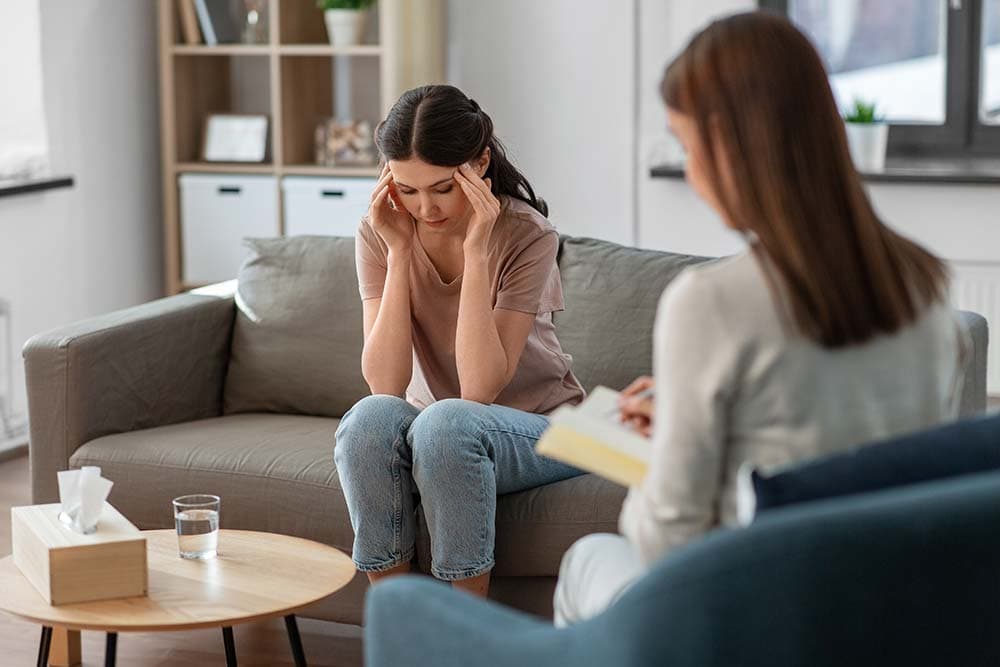 a woman working through an alcohol addiction treatment session