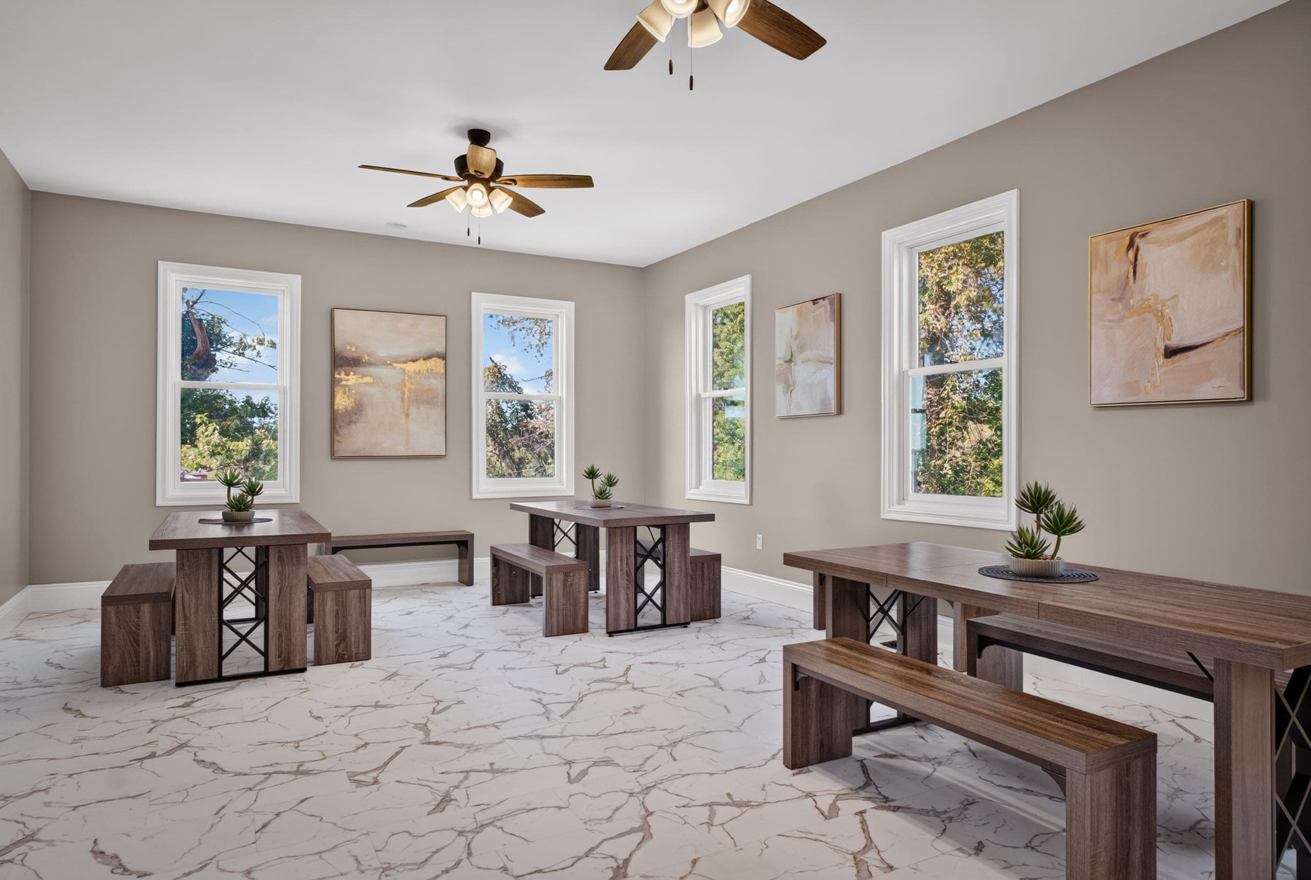 A dining room with wooden tables and benches