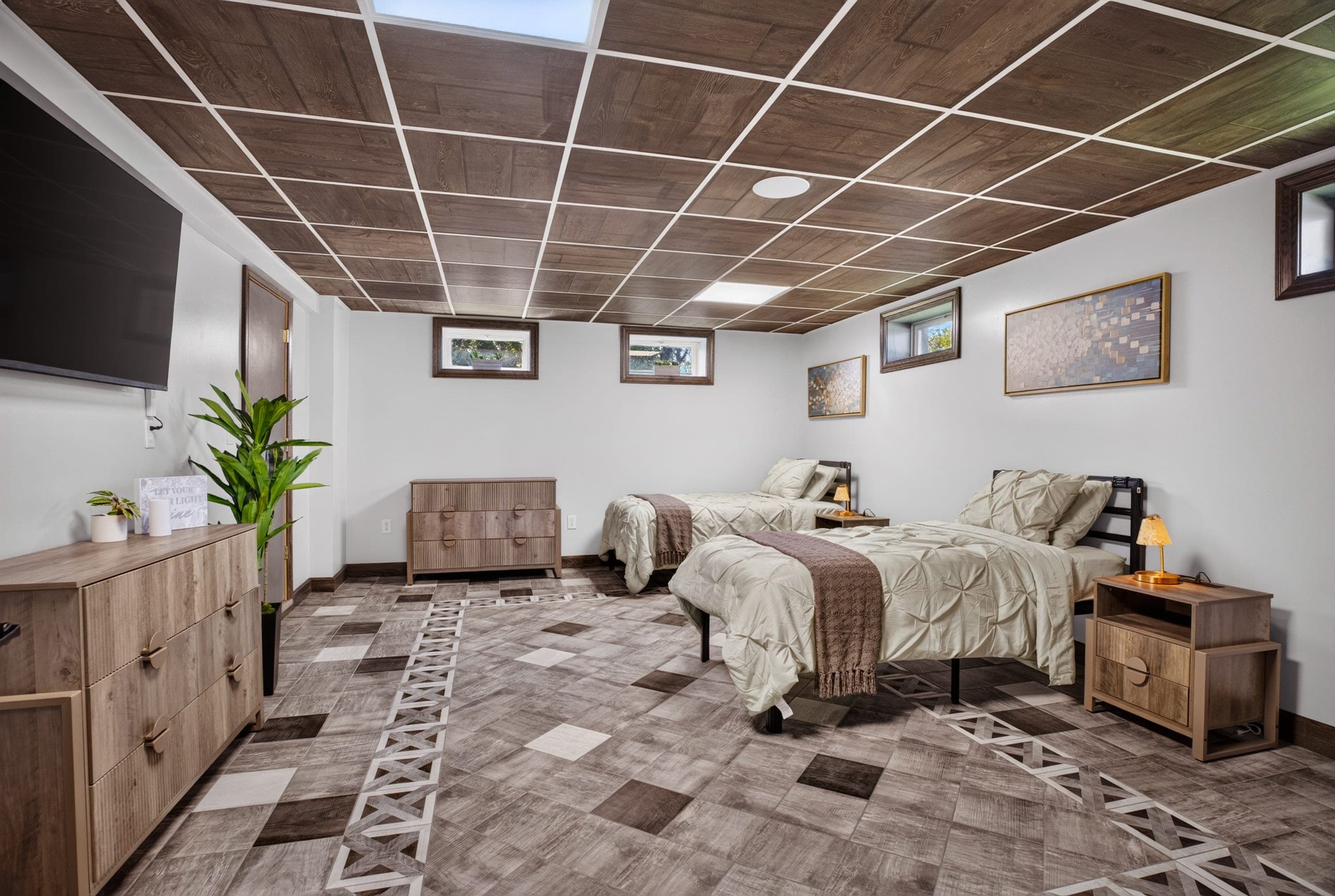 A shared bedroom with two made beds
