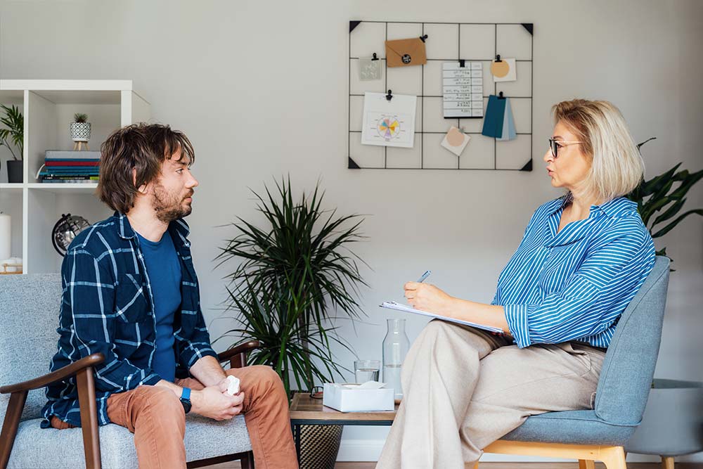 addiction-therapy a man seeing a therapist for addiction recovery