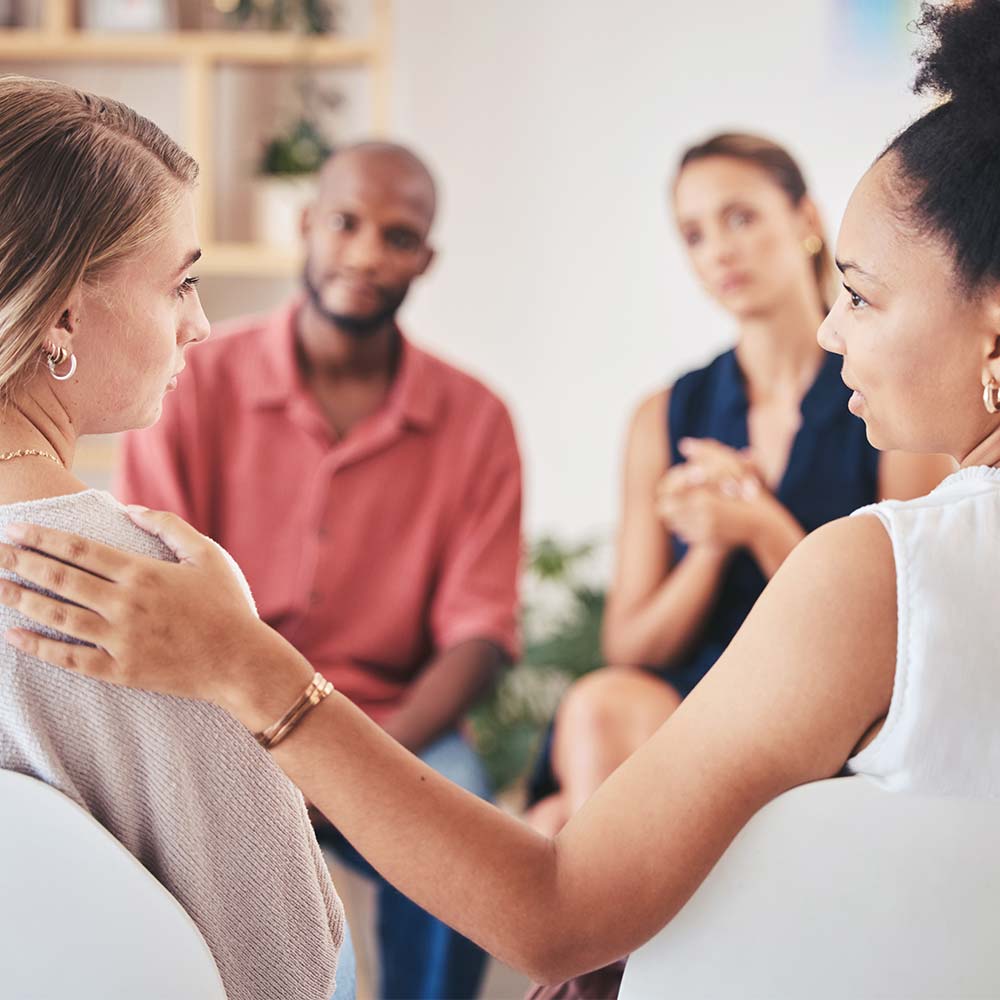 addiction-treatment-session two people supporting each other through addiction treatment in Ohio