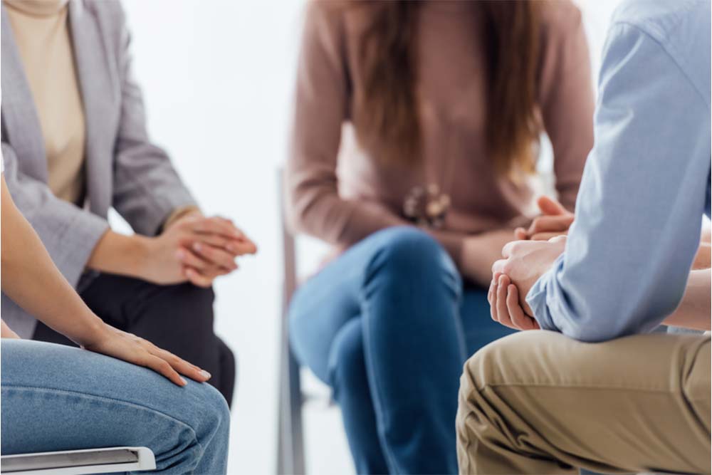 a group of people in cocaine addiction therapy together